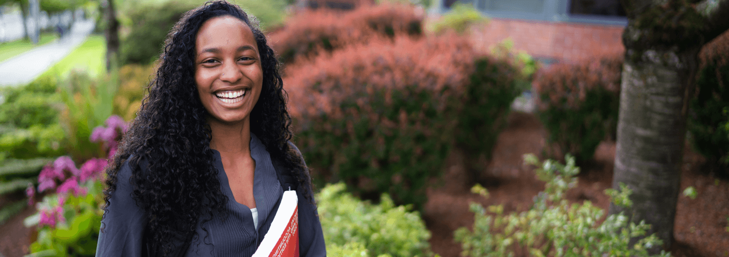 Business student in front of McKenna Hall